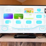 TV with a Wii video game interface displayed.